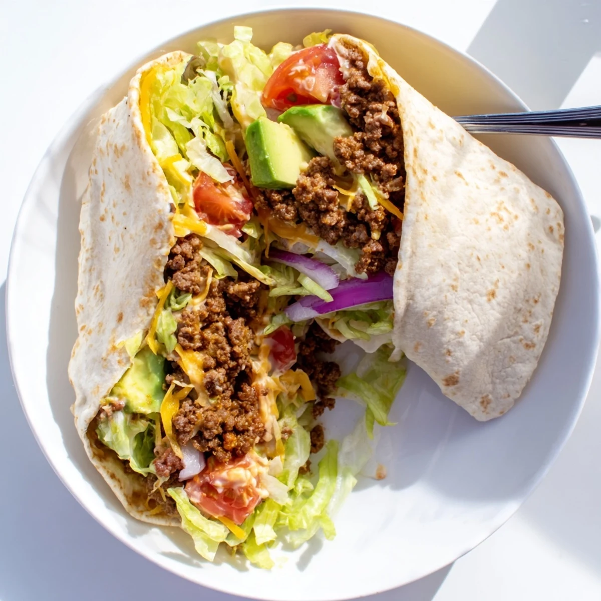 Perfect for a quick midday meal, this Beef Lunch Wrap Tortilla features melted cheddar cheese, fresh vegetables, and a portable, satisfying Tex-Mex lunch.