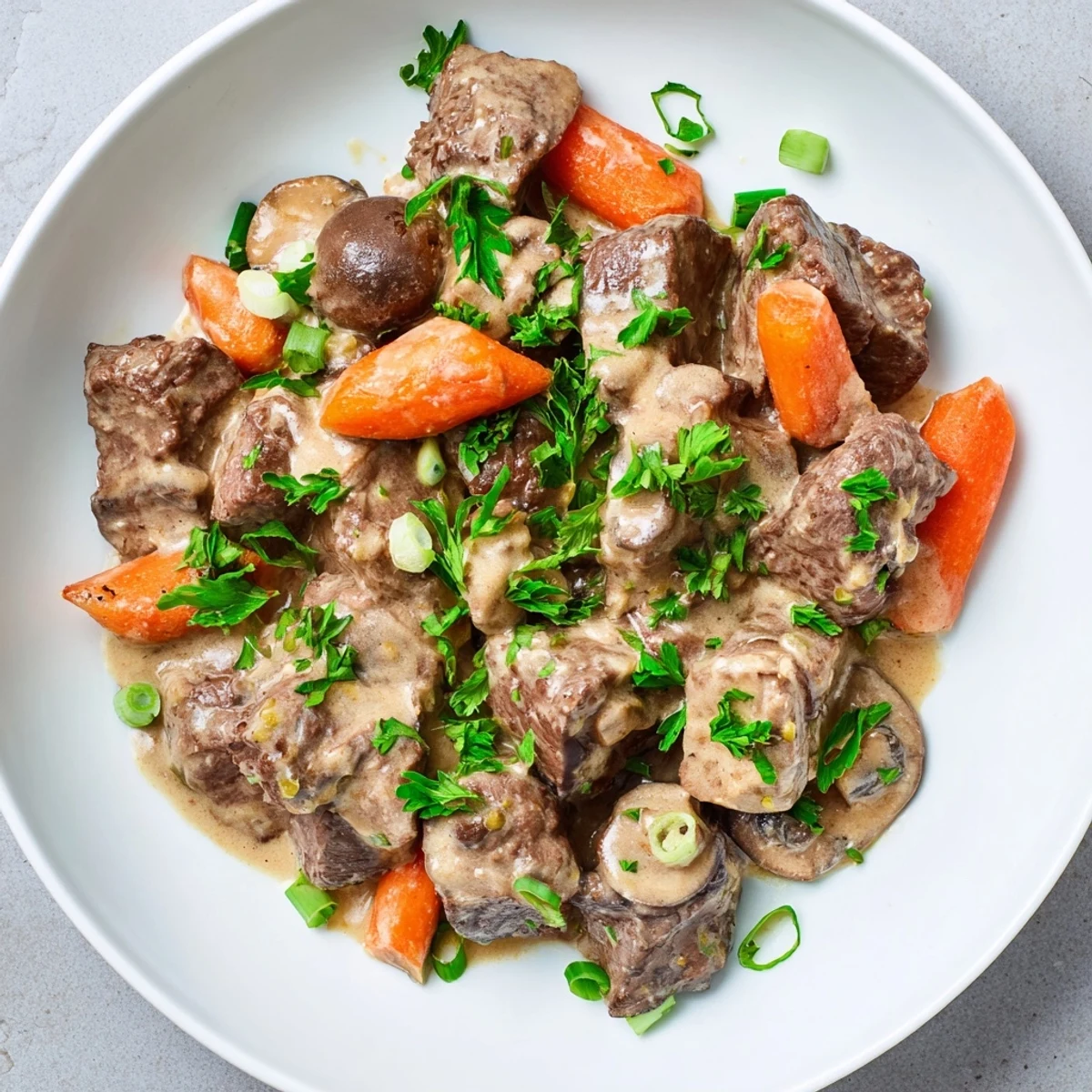 Slow-simmered Lemongrass Coconut Braised Beef with Mushrooms, tender chunks in a creamy, aromatic sauce.