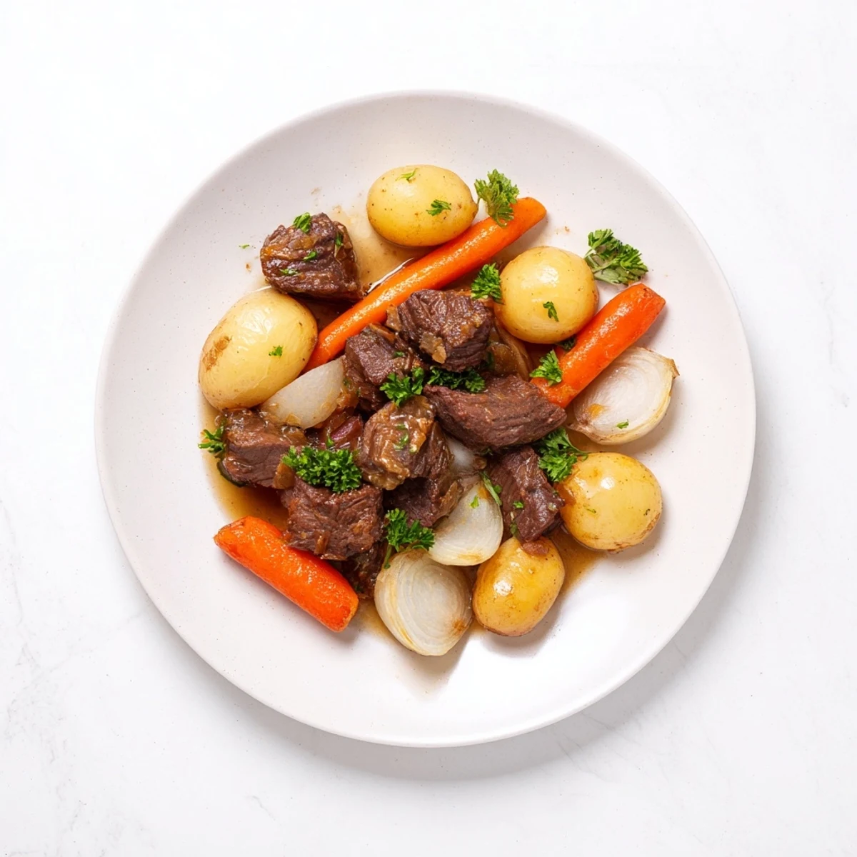 Hearty slow cooker garlic butter beef with potatoes, glistening in rich sauce and fresh parsley.