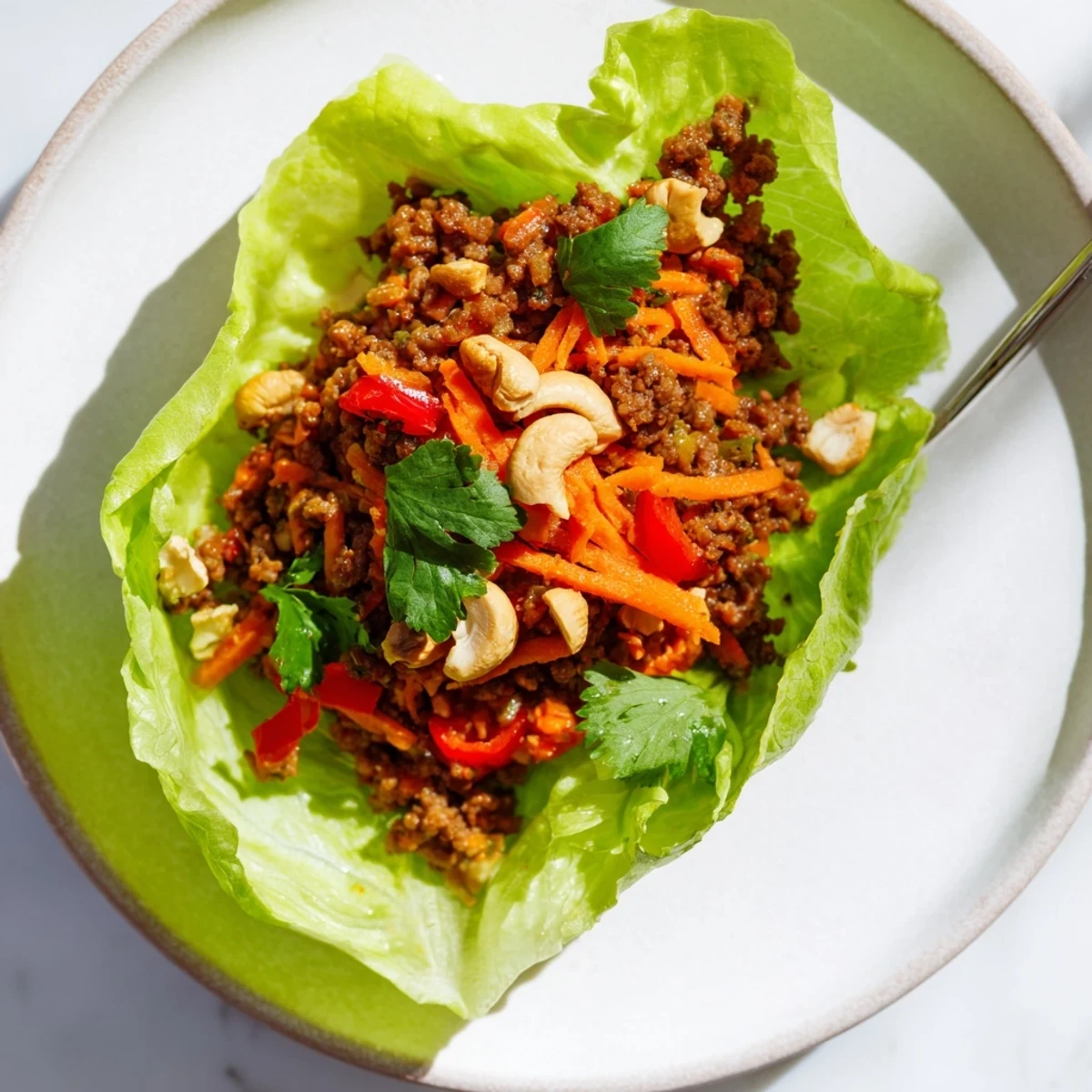 Crisp lettuce cups piled high with savory seasoned ground beef and crunchy roasted cashews