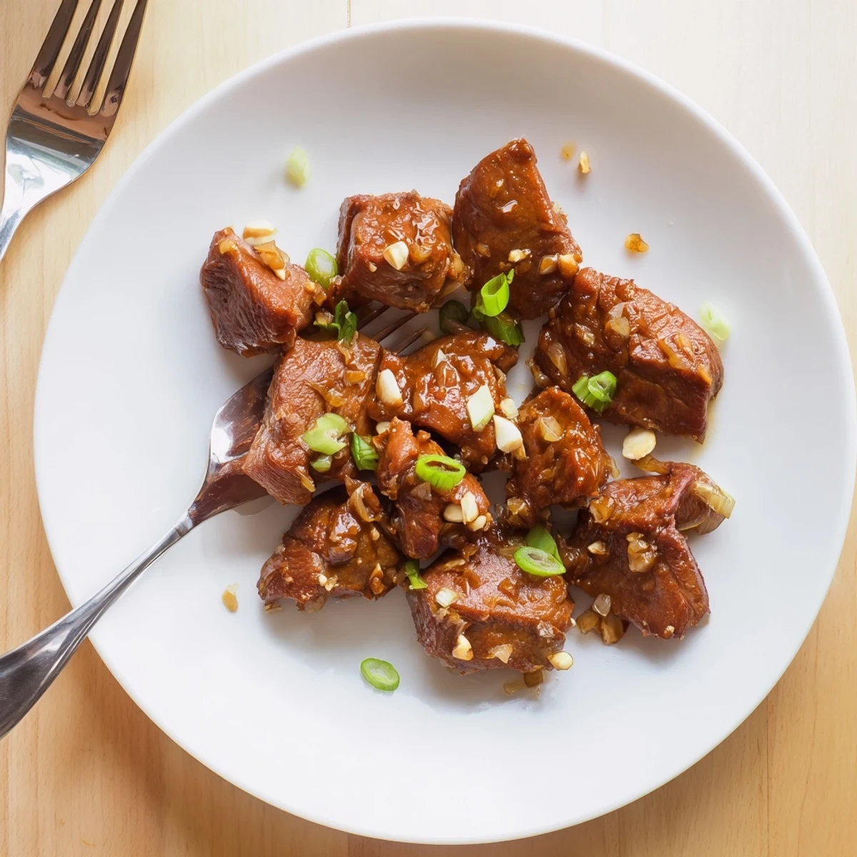 Golden brown Mongolian chicken pieces glazed in a sticky sweet and savory soy ginger sauce
