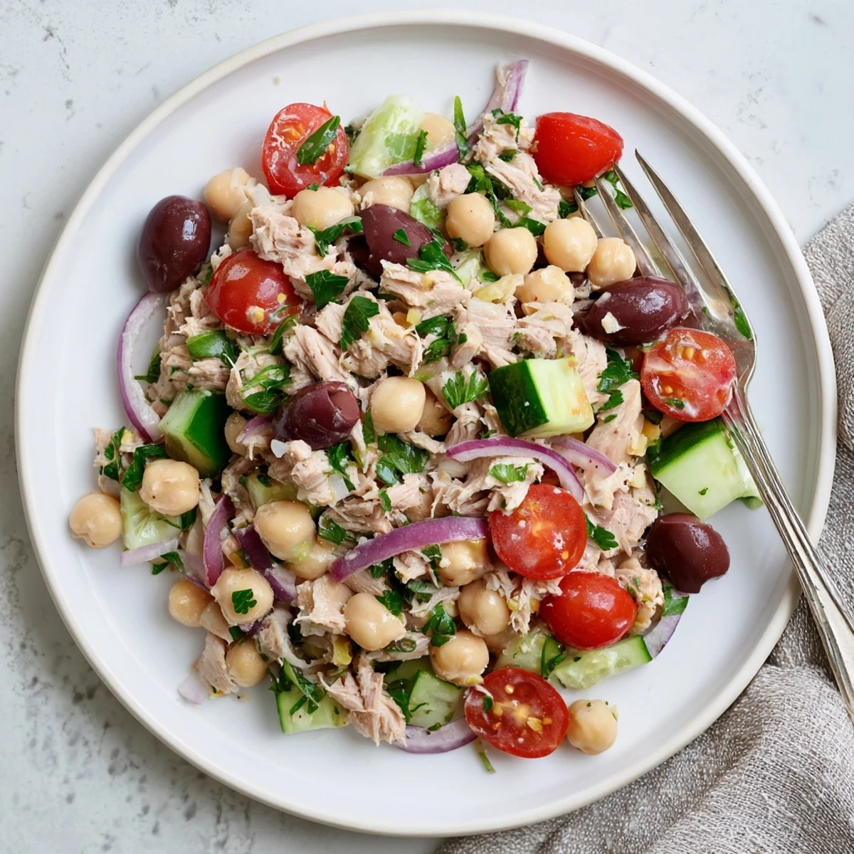 Hearty Tuna and Garbanzo Bean Salad with fresh parsley and cherry tomatoes