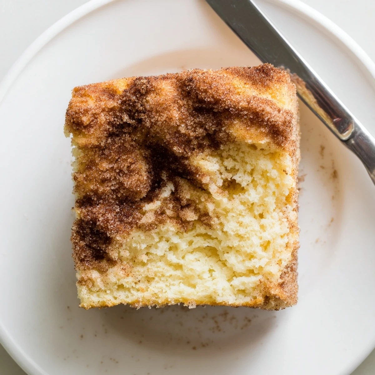 Golden cinnamon sugar donut bread loaf with a crunchy sugar crust and soft tender crumb