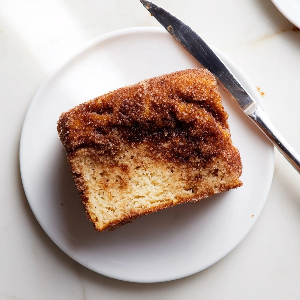 Homemade cinnamon sugar donut bread fresh from the oven with a sweet spiced coating