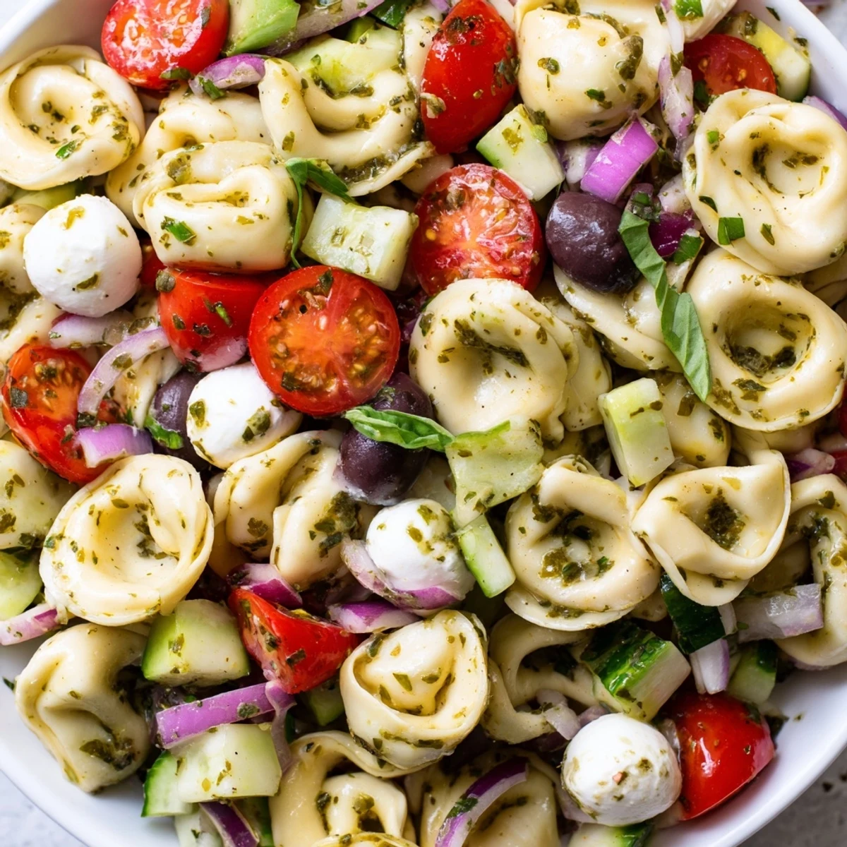 Cheese-filled tortellini pasta salad tossed with crisp vegetables and zesty Italian dressing