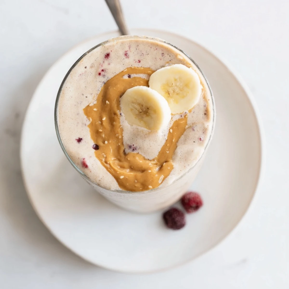 Two glasses of High Protein Smoothie garnished with chia seeds, ready to sip