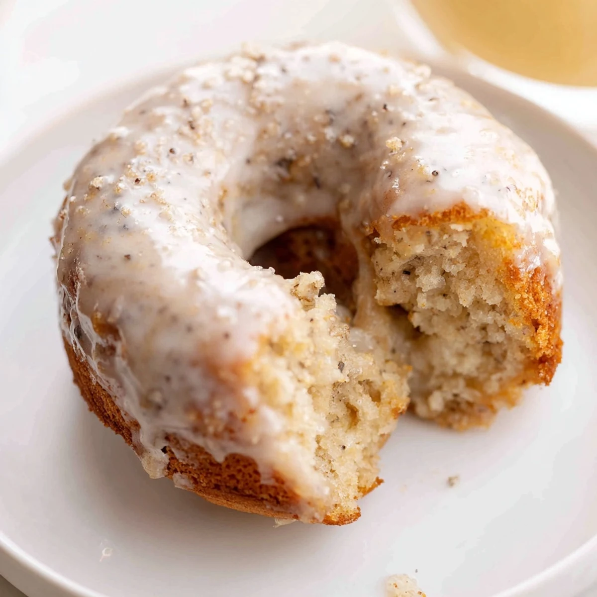 Banana Donuts baked golden, moist interior steaming on a cooling rack.
