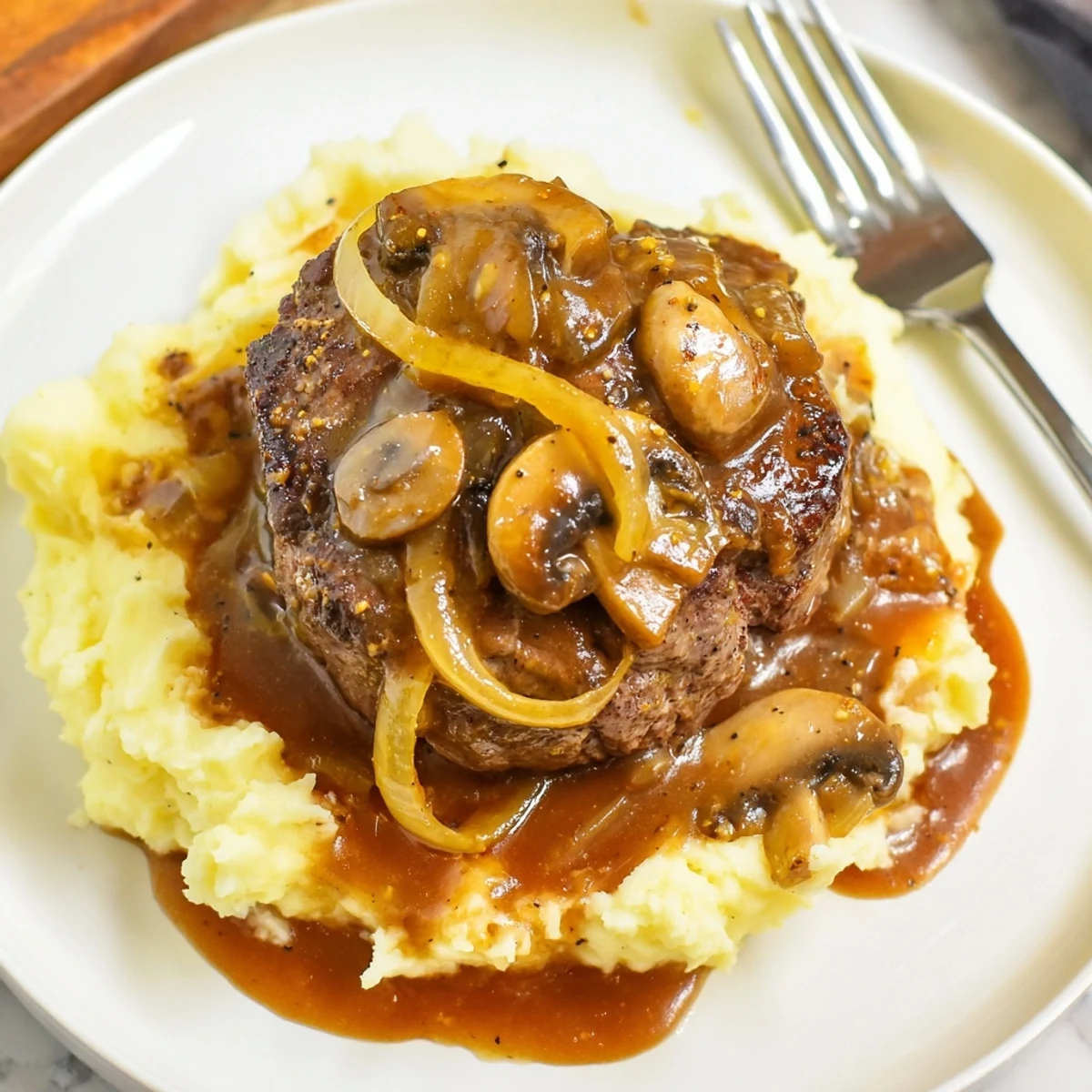 Skillet-simmered Country Style Smothered Cube Steak Recipe, fragrant onions and fork-tender steak