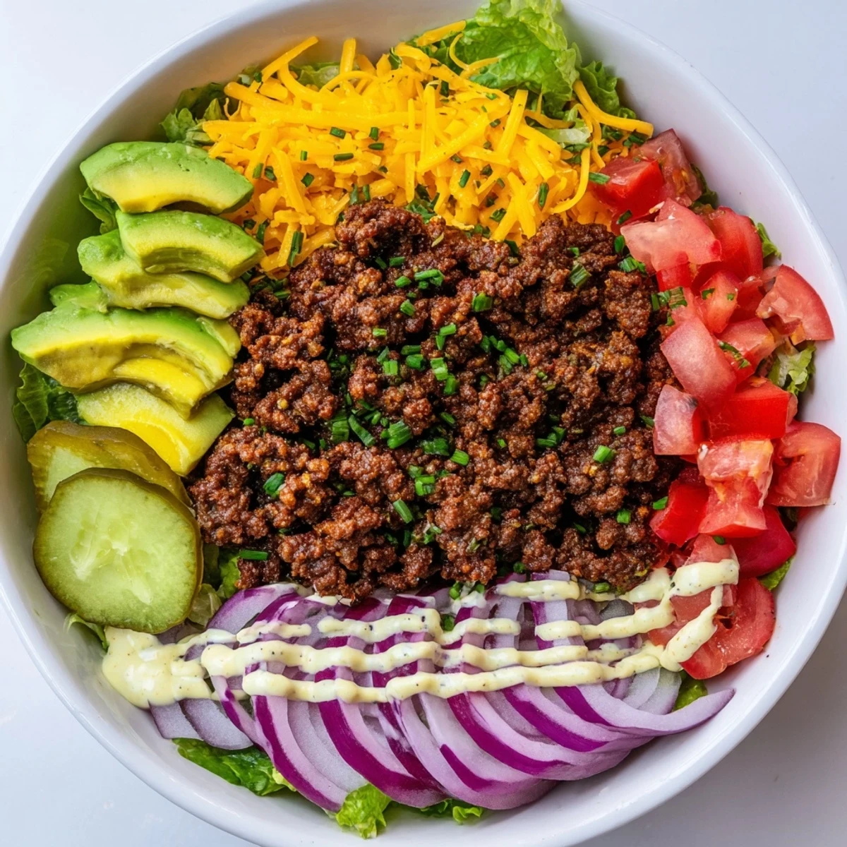 Juicy burger bowls loaded with seasoned ground beef, melted cheddar, and crisp fresh vegetables